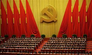 Delegates attend the closing session of 18th National Congress of the Communist Party of China at the Great Hall of the People in Beijing