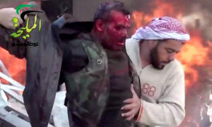 A bleeding man emerges from a bombed petrols station in Damascus