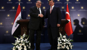 Turkey's Foreign Minister Davutoglu shakes hands with his Iraqi counterpart Zebari after a news conference in Ankara