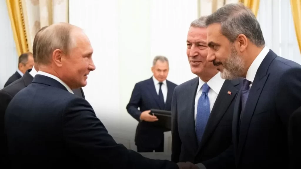 Putin and Fidan handshaking